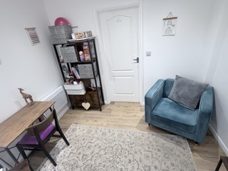 Photo of the counselling room and a small selection of toys.